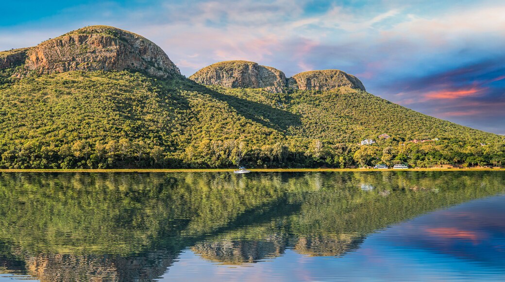 magaliesberg mountains view from hartbeespoort dam with blue sky