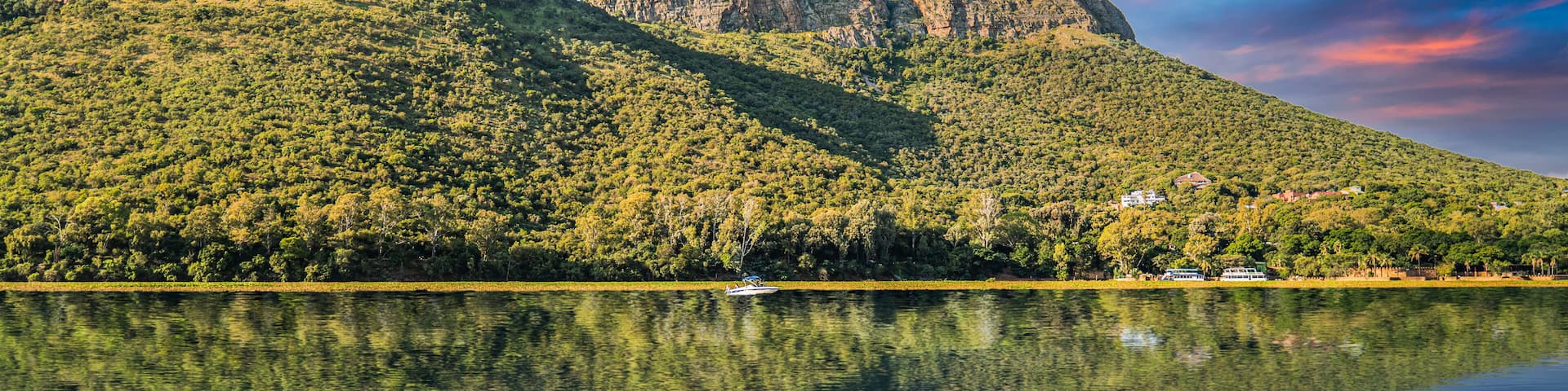 magaliesberg mountains view from hartbeespoort dam with blue sky