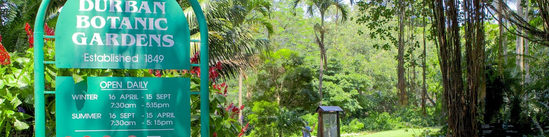 Durban Botanical Gardens which includes signage and a garden