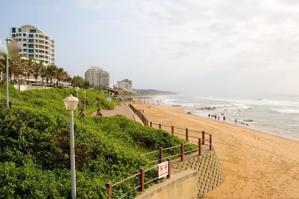 Umhlanga Rocks Beach featuring a beach, landscape views and a coastal town