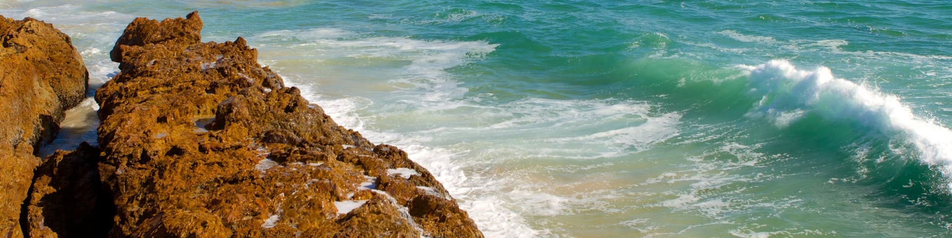 Hobie Beach showing rugged coastline, general coastal views and landscape views