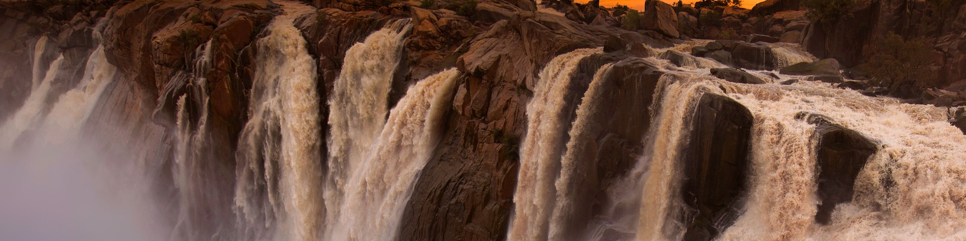 Augrabies water fall, raging water and full color sunsets