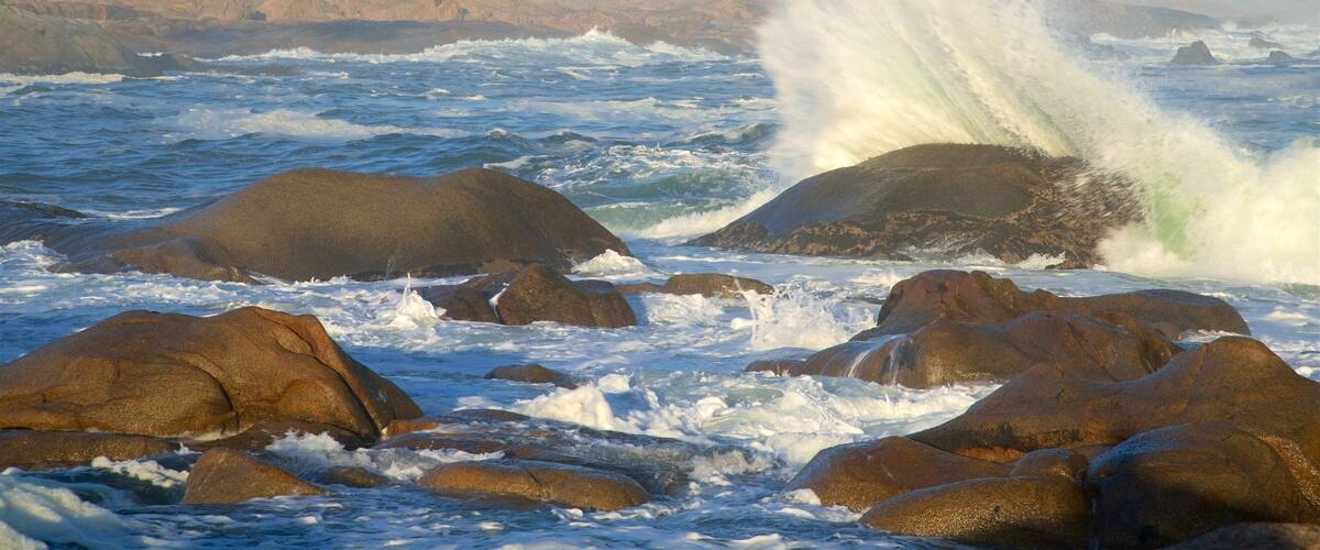 Cape Columbine Lighthouse which includes landscape views and rocky coastline