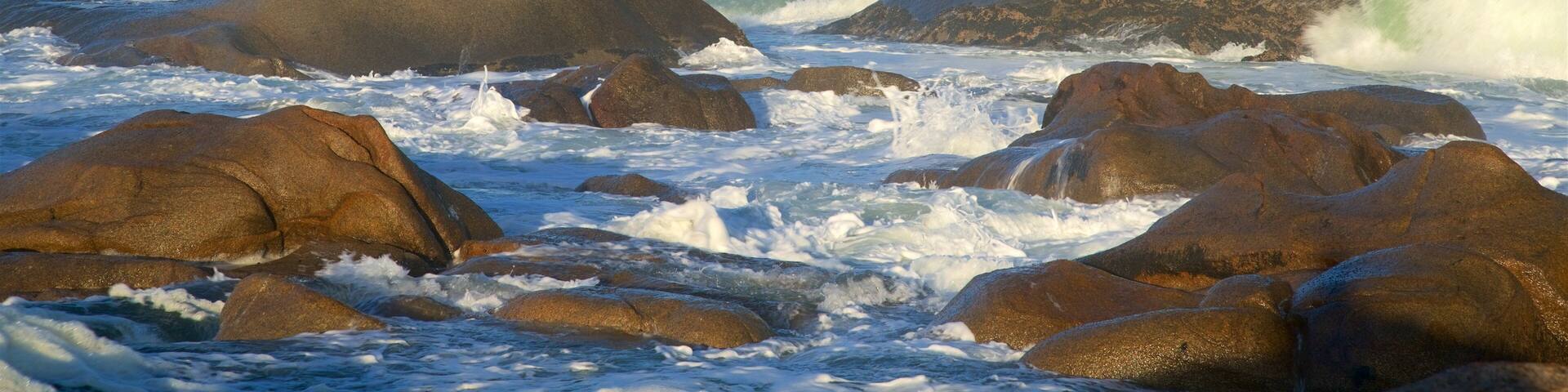 Cape Columbine Lighthouse featuring rugged coastline and landscape views