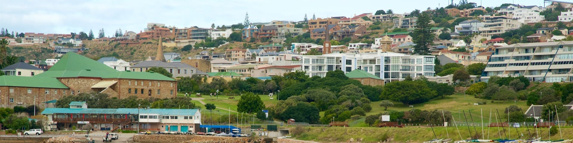 Santos Beach which includes a coastal town, a sandy beach and swimming