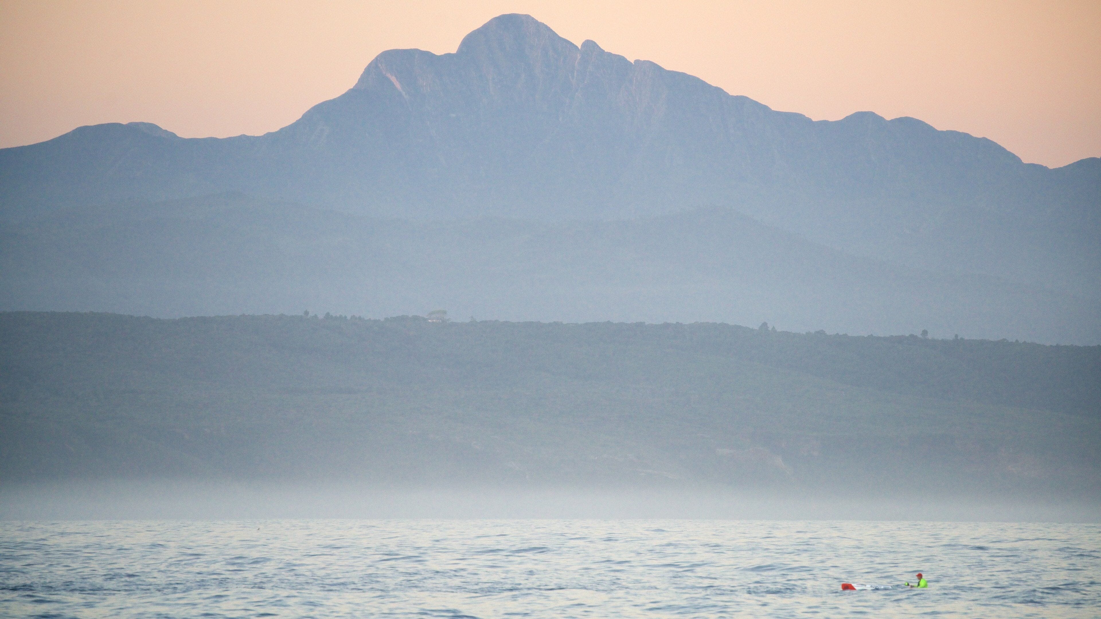 Plettenberg Bay Beach featuring tranquil scenes, mist or fog and a sunset