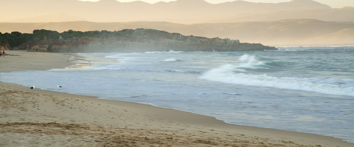 Plettenberg Bay Beach showing landscape views and a beach