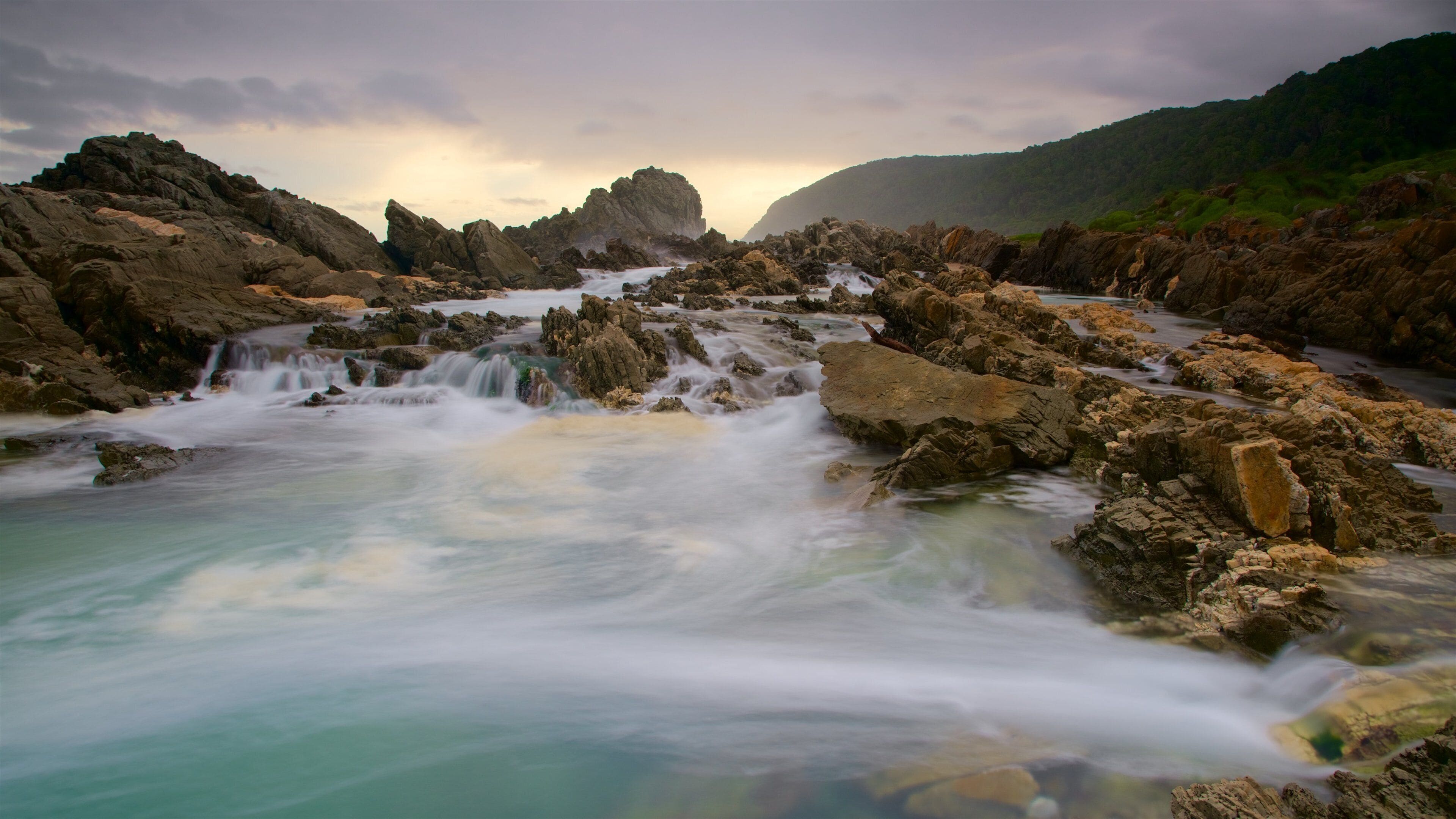 Tsitsikamma National Park featuring surf and rugged coastline