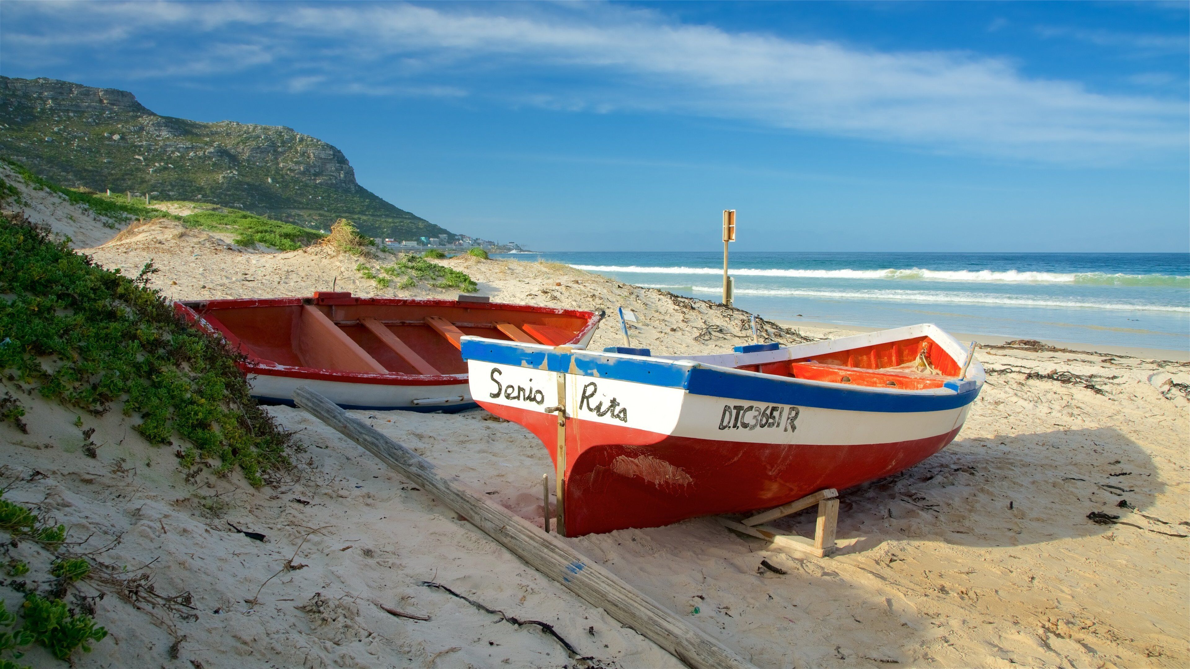 Fish Hoek stranden som inkluderar en strand och kajak eller kanot