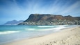 Fish Hoek Beach which includes a beach and a coastal town