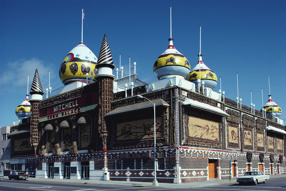 A building with multiple domed roofs and a marquee reading "Mitchell."