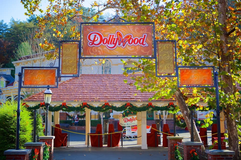 A Dollywood sign with a red roof and festive decorations.