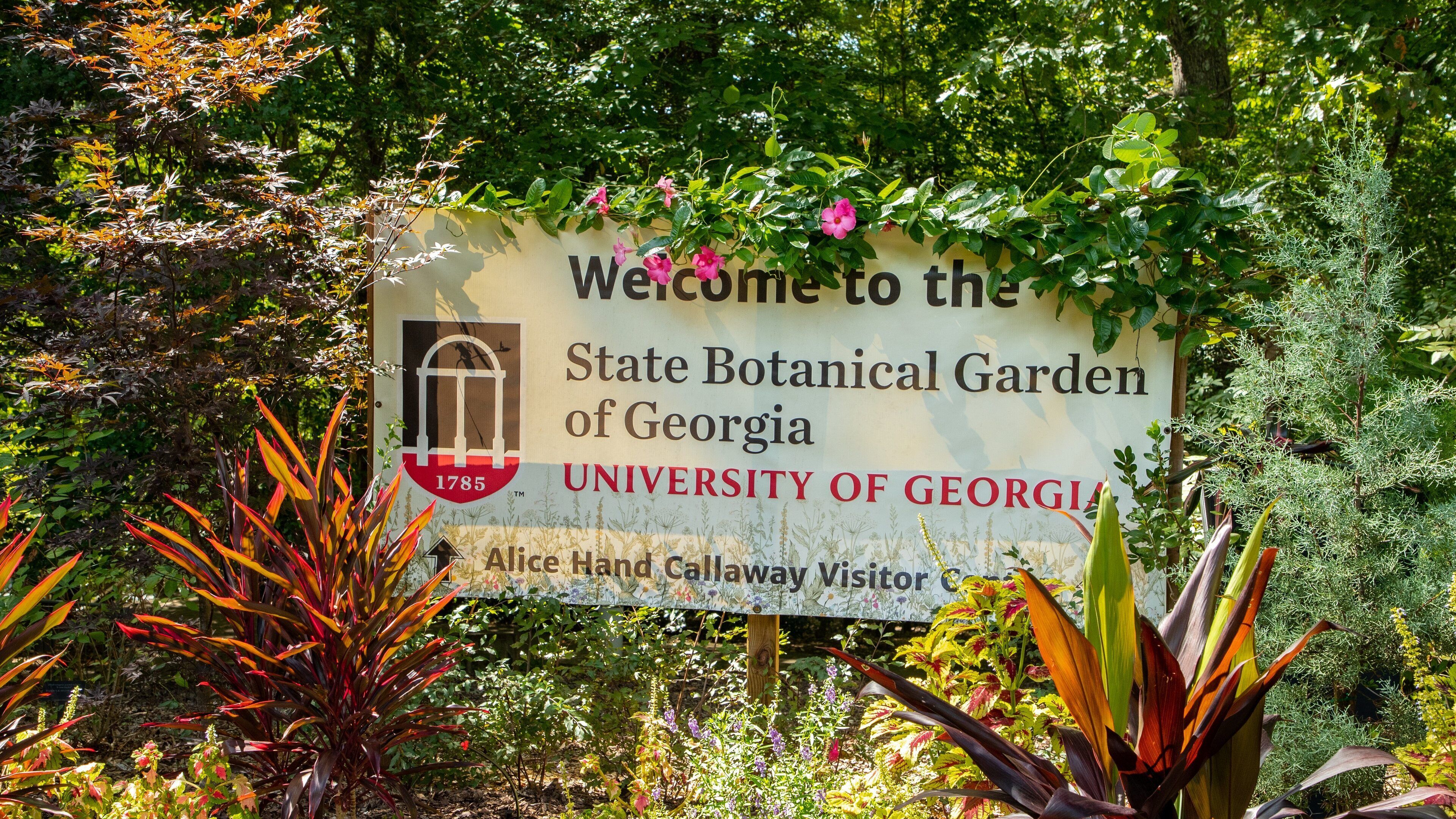 A sign welcoming visitors to the State Botanical Garden of Georgia at the University of Georgia.
