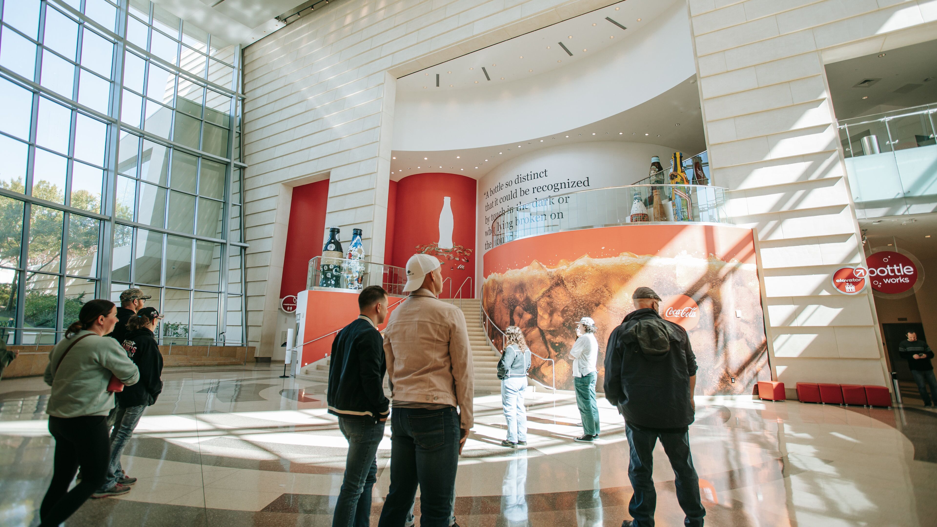 World of Coca-Cola showing interior views as well as a small group of people