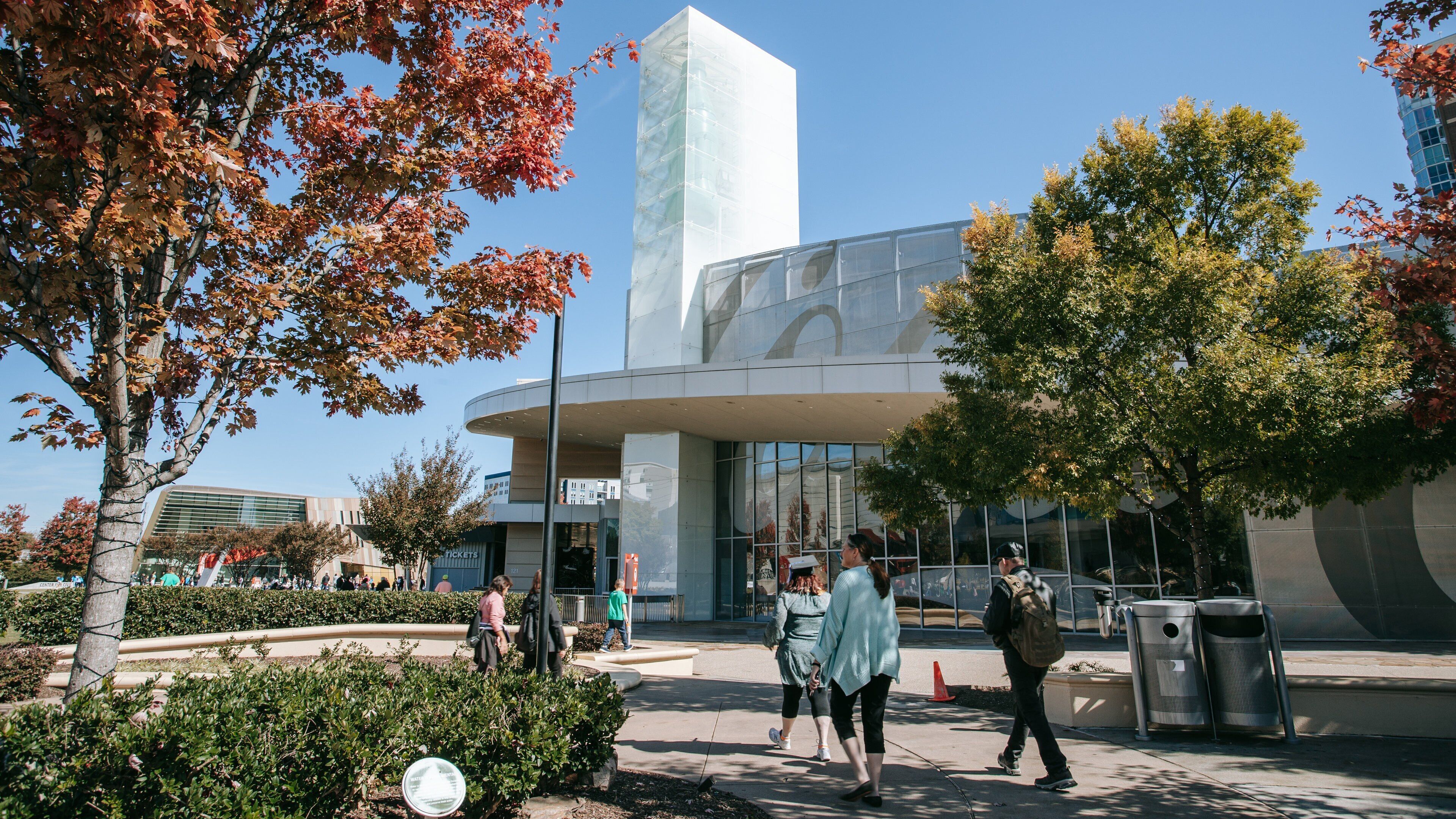 World of Coca-Cola featuring street scenes as well as a small group of people