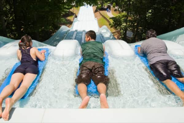 Six Flags White Water which includes a water park and rides as well as a small group of people