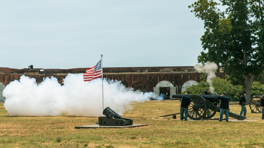 Fort Pulaski National Monument featuring heritage elements and performance art as well as a small group of people