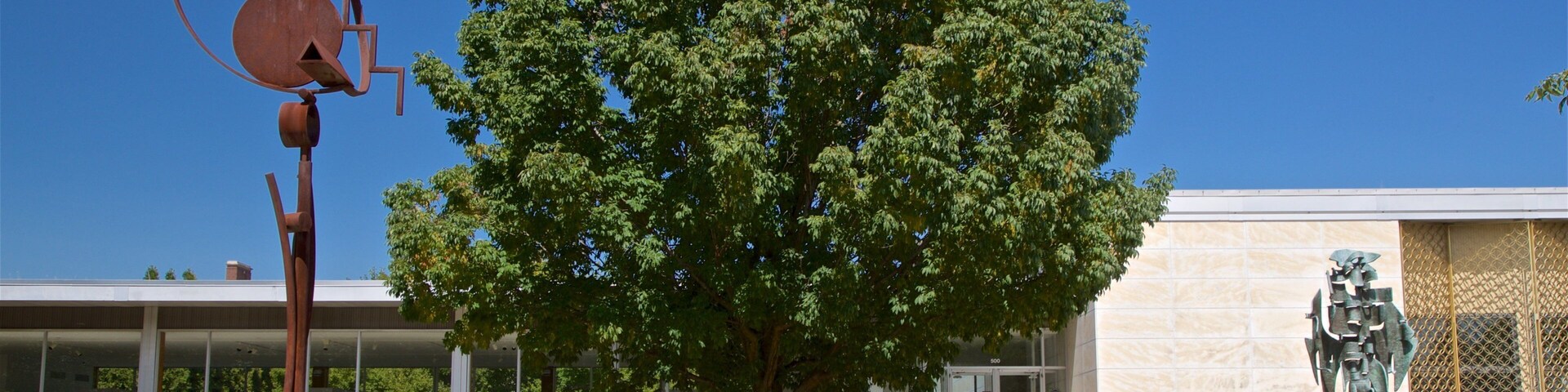 Krannert Art Museum showing outdoor art and a garden