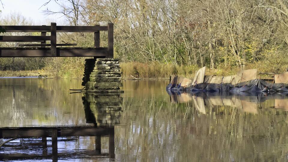 Making ends meet for public enjoyment: Early stage of reconstruction of footbridge across Salt Creek, Oak Brook, Illinois, in autumn