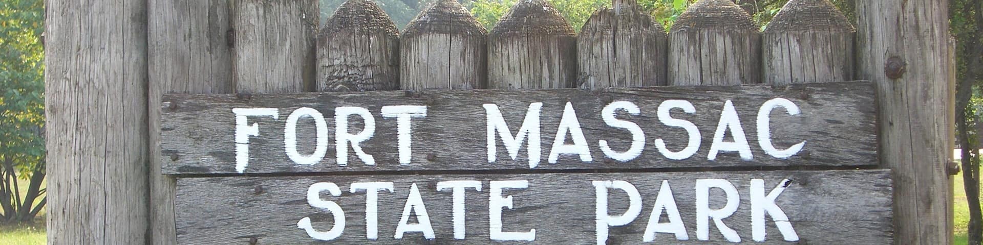 A wooden sign with the text "Fort Massac State Park".