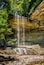 Big Clifty Falls, a beautiful waterfall in Clifty Falls State Park by Madison, Indiana, plunges over a cliff at the head of a rugged rocky canyon as the creek flows down to the nearby Ohio River.