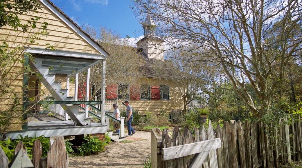 Vermilionville featuring a house and a park as well as a couple