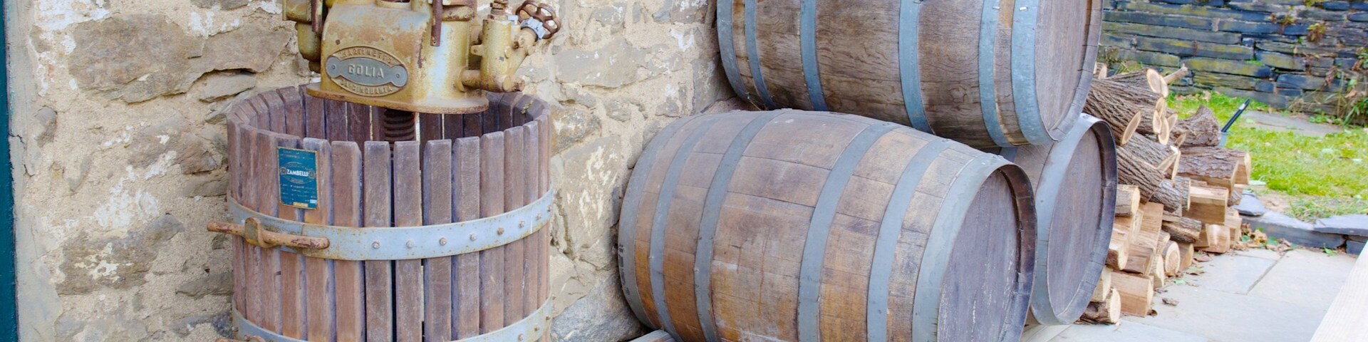 Experience the charm of Boordy Vineyards with traditional winemaking equipment in Hydes, Maryland during a sunny afternoon