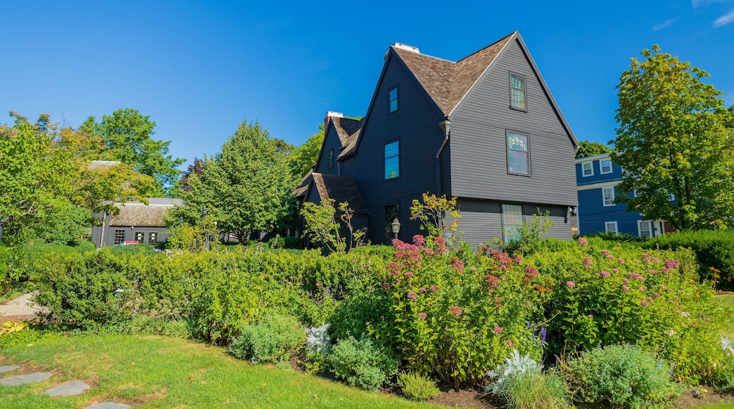 House of the Seven Gables featuring wildflowers, a garden and a small town or village