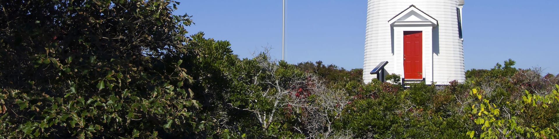Cape Poge lighthouse is located on Chappaquiddick Island on the northeast point of the Cape Poge Wildlife Refuge, on Martha's Vineyard, Massachusetts.. ; Shutterstock ID 260289239; Purchase Order: -