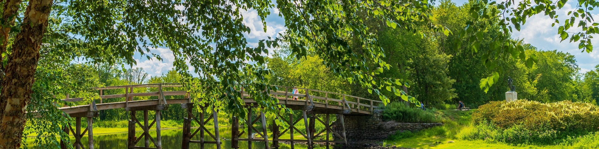 Old North Bridge featuring a river or creek and a bridge