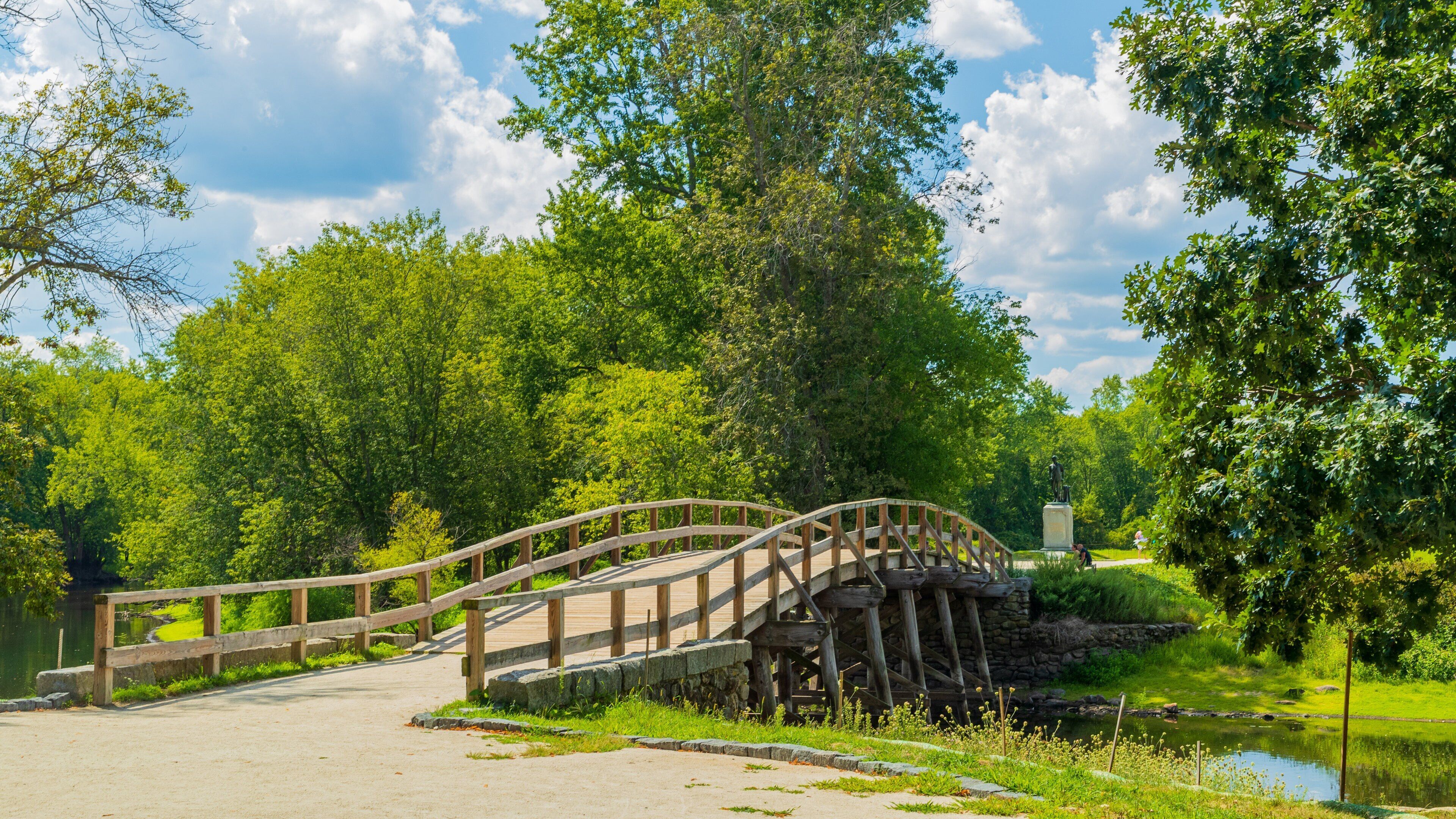 Old North Bridge which includes a pond, a bridge and a garden