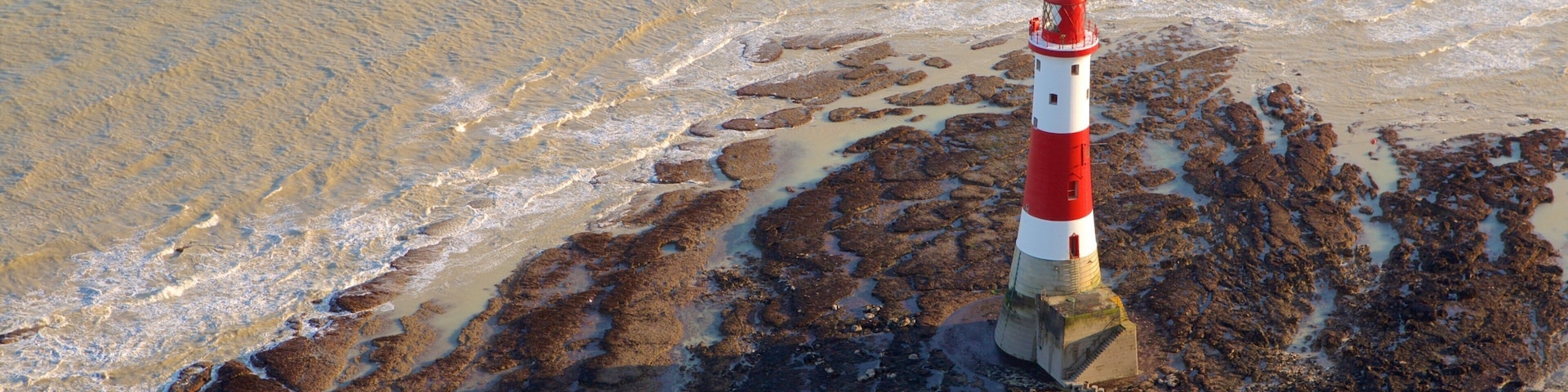 Beachy Head featuring general coastal views and a lighthouse