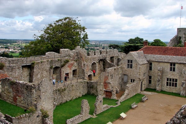 Carisbrooke Castle is a historic motte-and-bailey castle located in the village of Carisbrooke, near Newport, Isle of Wight, England. Charles I was imprisoned at the castle in the months prior to his trial
The site of Carisbrooke Castle may have been occupied in pre-Roman times. A ruined wall suggests that there was a building there in late Roman times. The Anglo-Saxon Chronicle mentions that Wihtgar, cousin of King Cynric of Wessex, died in AD 544, and was buried there. The Jutes may have taken over the fort by the late 7th century. An Anglo-Saxon stronghold occupied the site during the 8th century. Around 1000, a wall was built around the hill as a defence against Viking raids.