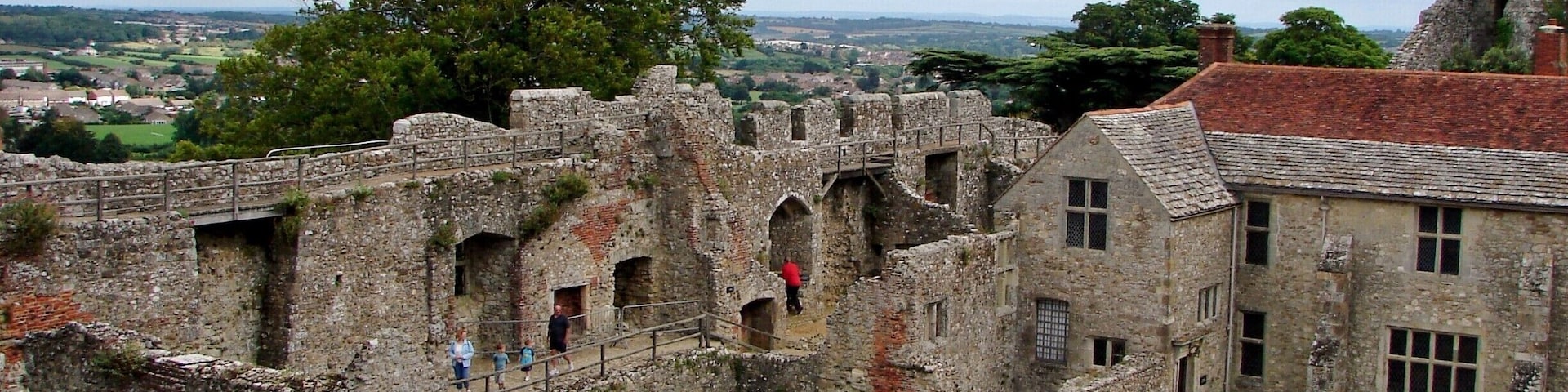 Carisbrooke Castle is a historic motte-and-bailey castle located in the village of Carisbrooke, near Newport, Isle of Wight, England. Charles I was imprisoned at the castle in the months prior to his trial
The site of Carisbrooke Castle may have been occupied in pre-Roman times. A ruined wall suggests that there was a building there in late Roman times. The Anglo-Saxon Chronicle mentions that Wihtgar, cousin of King Cynric of Wessex, died in AD 544, and was buried there. The Jutes may have taken over the fort by the late 7th century. An Anglo-Saxon stronghold occupied the site during the 8th century. Around 1000, a wall was built around the hill as a defence against Viking raids.