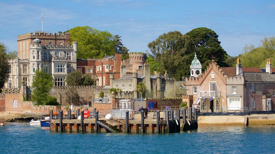 Brownsea Castle which includes heritage architecture and a bay or harbour