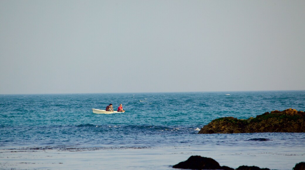 Lulworth Cove Beach showing general coastal views and boating