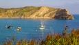 Lulworth Cove Beach which includes boating and a bay or harbor