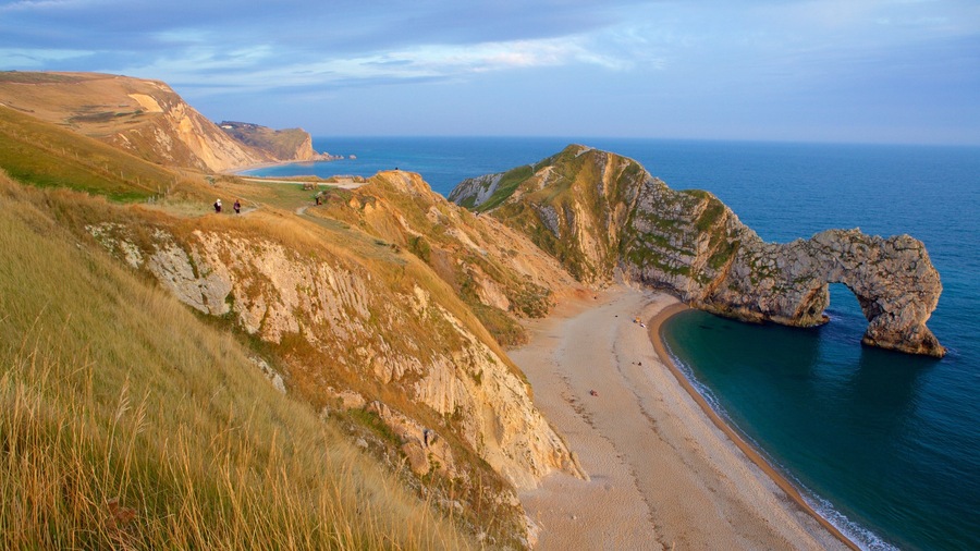 Durdle Door featuring general coastal views, rugged coastline and tranquil scenes