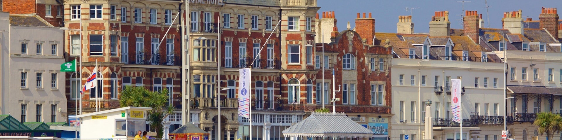 Weymouth Beach featuring a beach as well as a large group of people