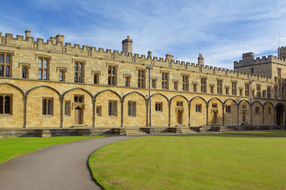 A historic building with a long corridor and arched windows.