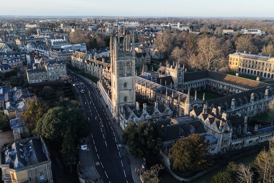 Aerial view showing Magdalen College, Oxford, United Kingdom, with historic buildings and city