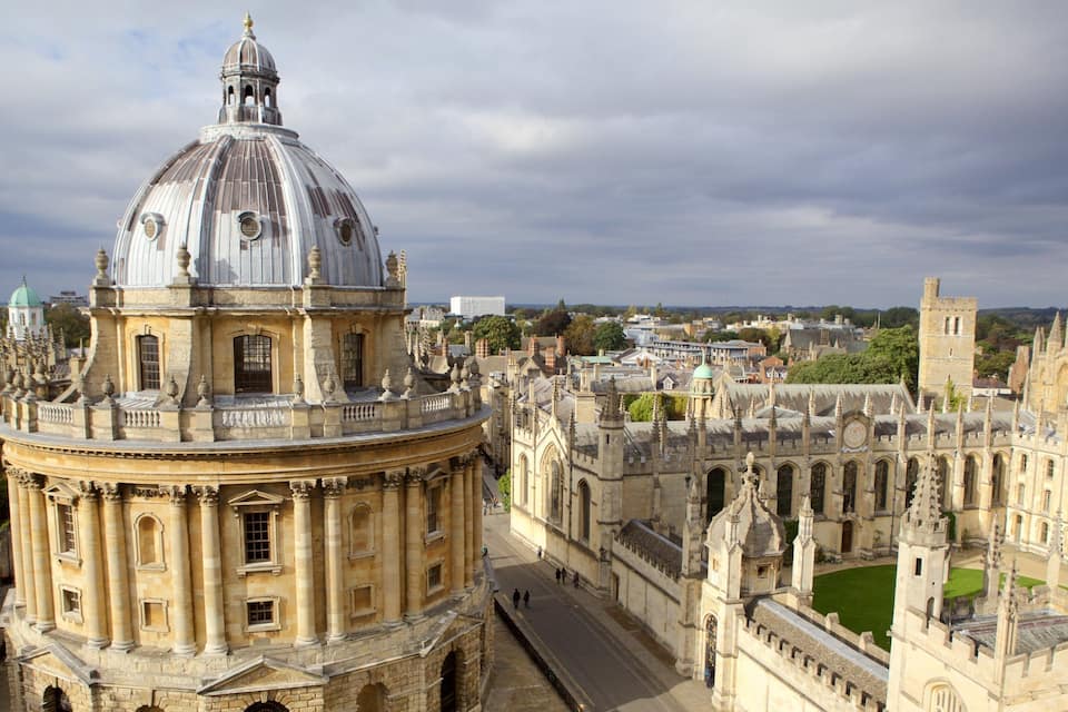 A historic university campus with a prominent dome and Gothic architecture.