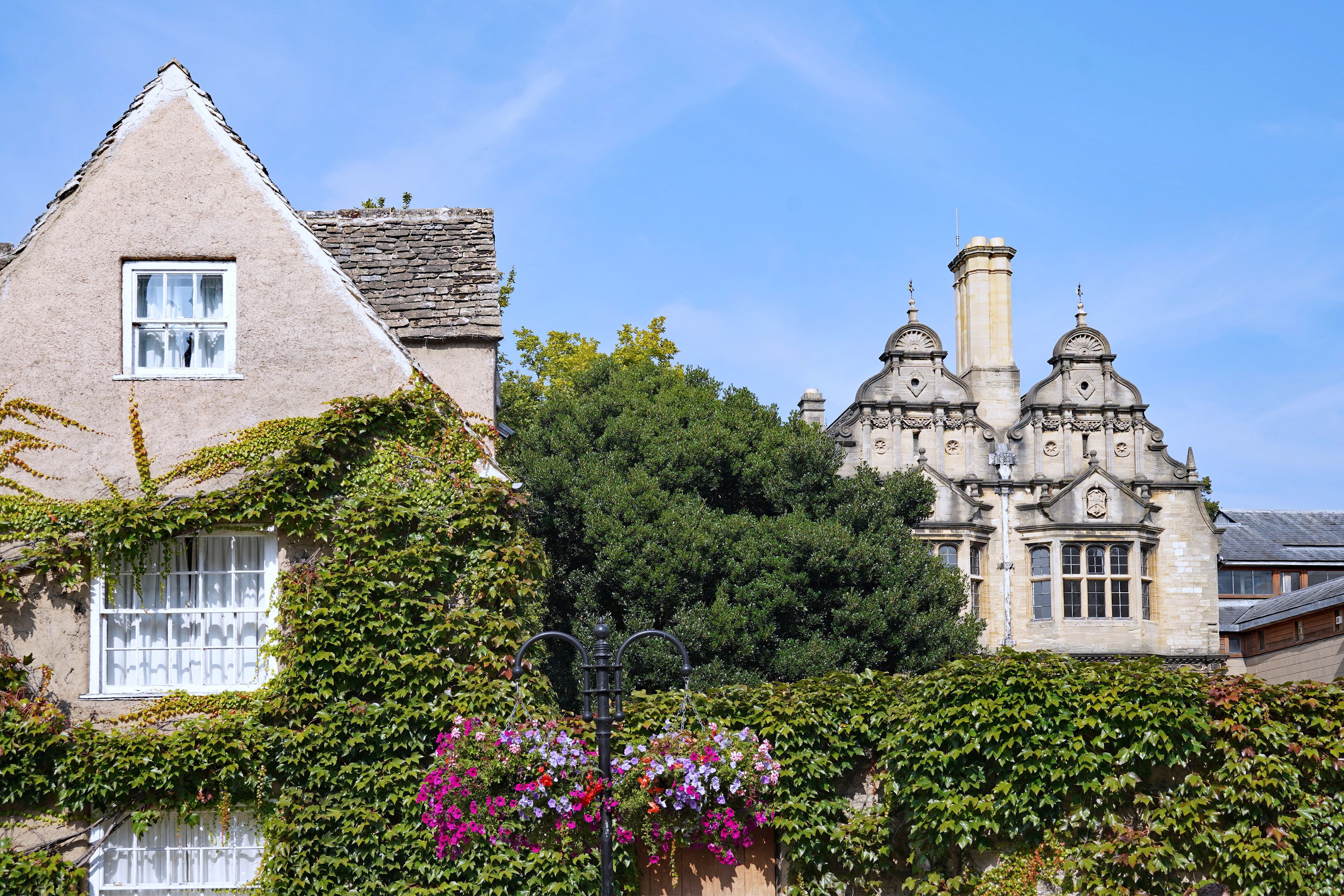 A historic building with ivy-covered walls and a traditional stone facade.