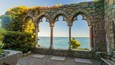 Hammond Castle which includes heritage elements, general coastal views and a sunset