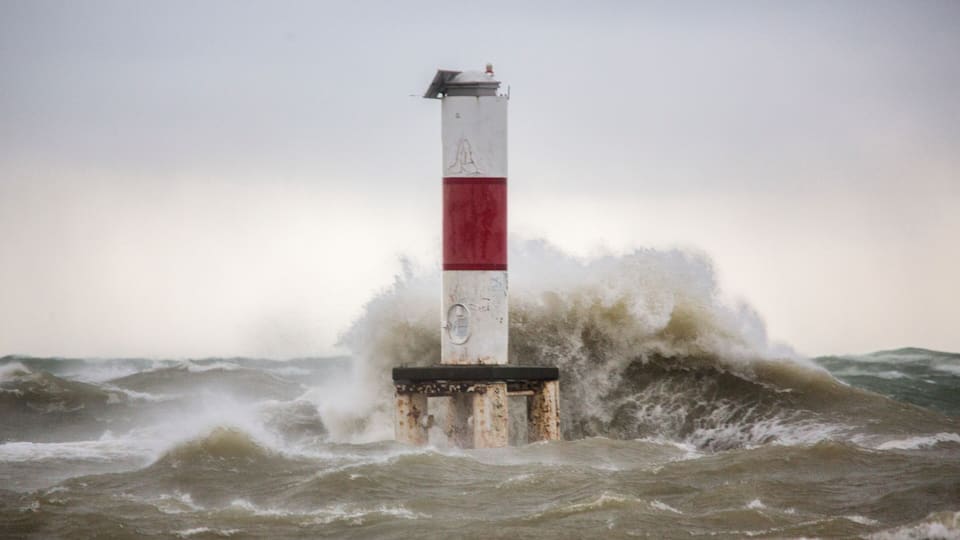 A lighthouse amidst rough seas.