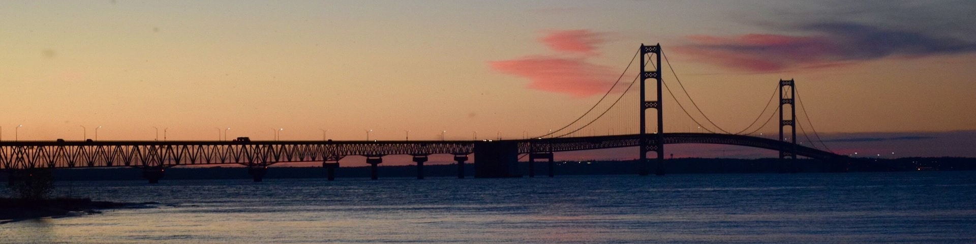 The Mackinac Bridge spans the Straits of Mackinac, connecting lower and upper Michigan. Lake Huron is in the foreground and Lake Michigan is in the background behind the bridge. I liked the patterns created by the bridge structure. #patterns #michigan #bridges #AquaTrove #blue #Nature