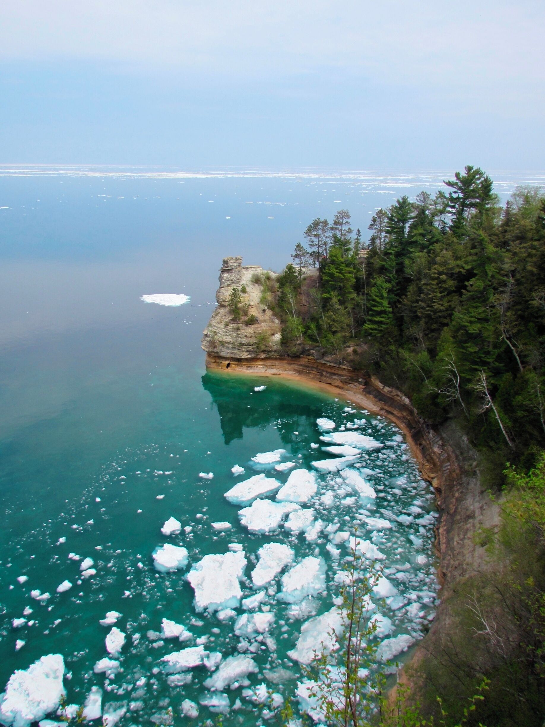A view of the northern thaw. Shot on Memorial Day after one of the coldest winters on Lake Superior. Ice bergs  or "floes" would break off the larger deep-water shelf each night and would float into shore by morning.