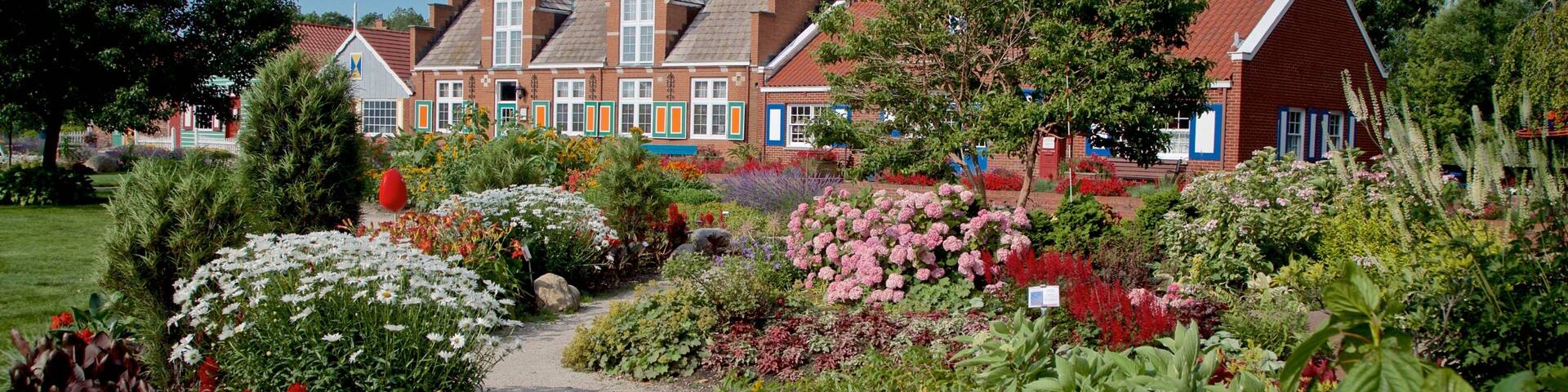 Windmill Island featuring wildflowers and a garden