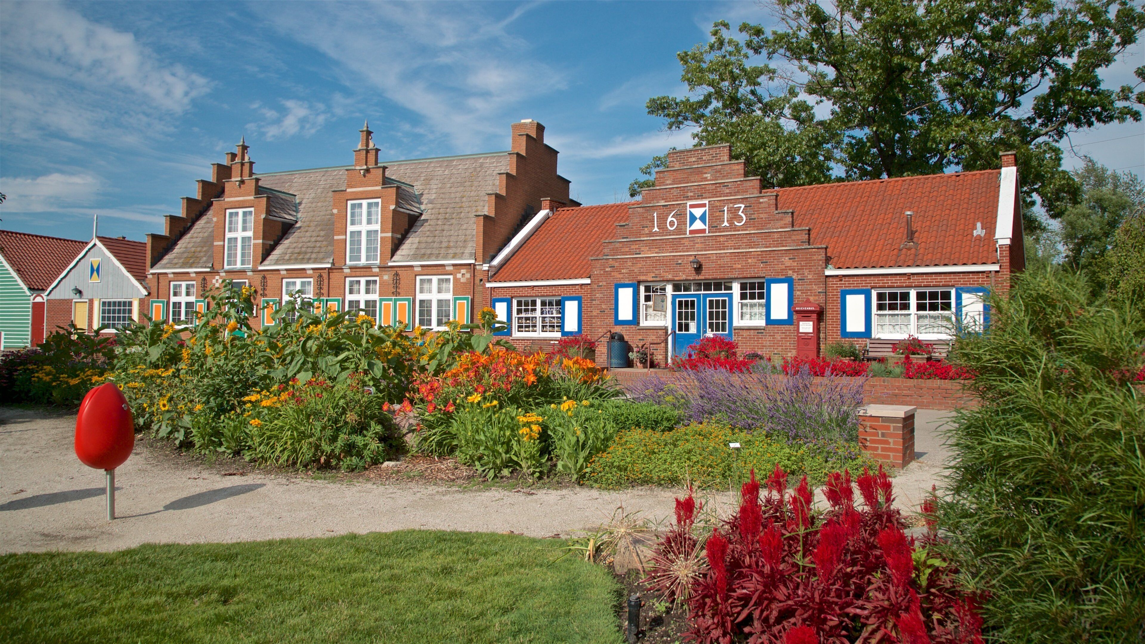 Windmill Island showing a small town or village, wild flowers and a garden