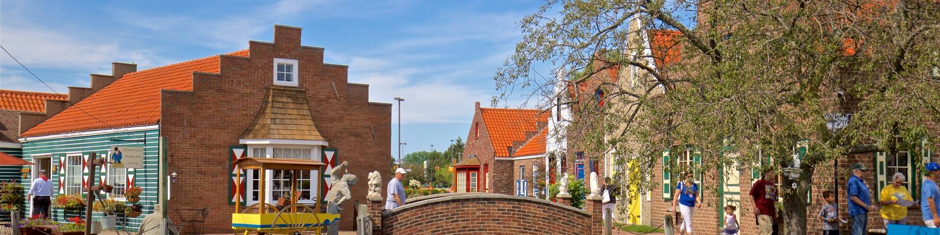 Dutch Village showing a river or creek, a bridge and a small town or village